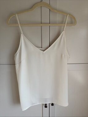 Classic White V-Neck Spaghetti Strap Cami. Silk looking with adjustable straps.